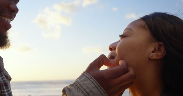 Young Couple Sharing Tender Moment by Beach at Sunset - Download Free Stock Images Pikwizard.com