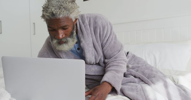 Senior Man Relaxing in Bed Using Laptop - Download Free Stock Images Pikwizard.com