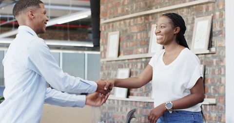 Professional Handshake in Modern Office Environment
