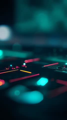 Vertical video showing DJ controller receiving shifting neon LED patterns and pulsing pads