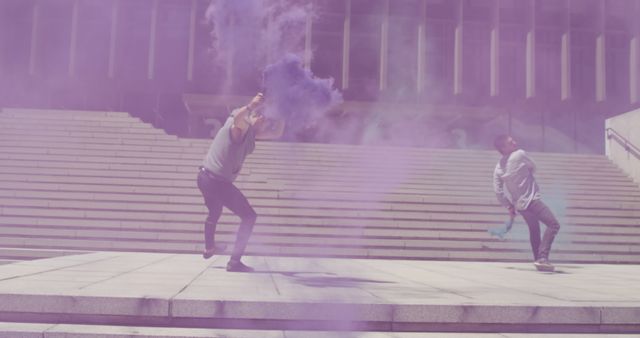 Two Men Celebrating With Purple Smoke Bombs on City Steps - Download Free Stock Images Pikwizard.com