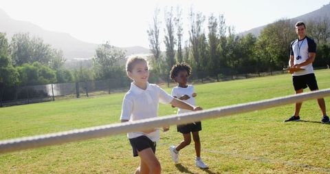 Children Racing on a Sunny Day at School Sports Event