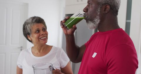 Seniors Enjoying Healthy Green Juice Together at Home