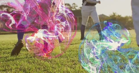 Baseball players walking on grass wearing cleats and knee-high socks with colorful swirls