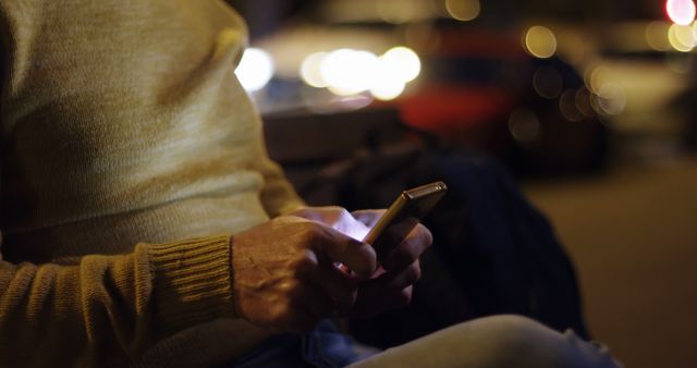 Man Using Smartphone at Night with Blurred City Lights in Background - Download Free Stock Images Pikwizard.com