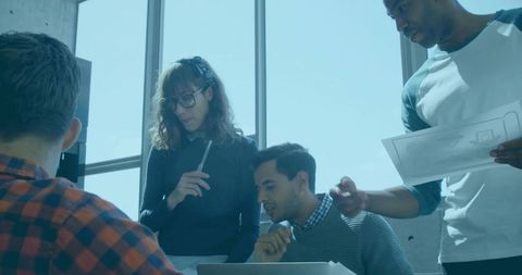 Collaborative Team Reviewing Designs in Modern Office Setting