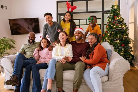 Diverse Family Celebrating Christmas Together in Cozy Living Room