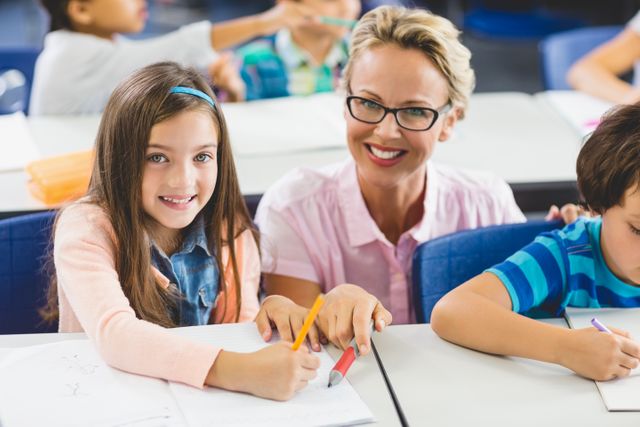 Teacher assisting young girl with her studies in a classroom setting. Ideal for educational content, school promotions, academic programs, and teaching resources.