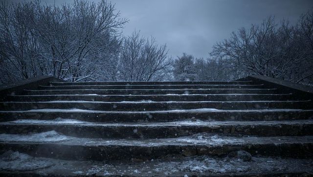 Mossy Worn Stone Staircase Dusted with Snow Leading into Bare Winter Trees at Dusk