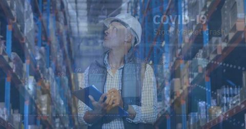 Warehouse Worker Analyzing Pandemic Stock Impact in Industry Setting