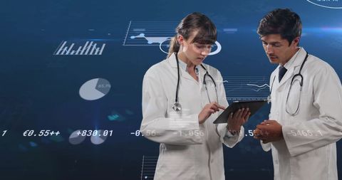 Doctors Analyzing Data on Tablet with Financial Graphics