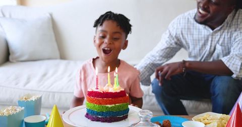 Multiracial Family Celebrating Young Boy's Birthday at Home