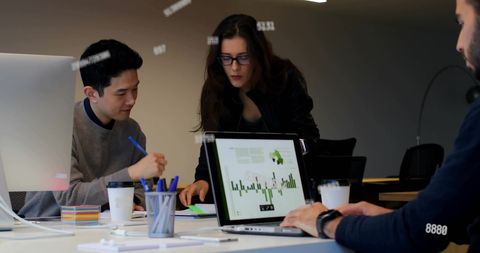 Diverse Team Collaborating on Digital Project in Modern Office