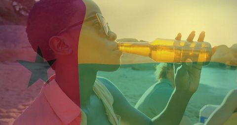 Woman Drinking at Beach with Ghana Flag Overlay
