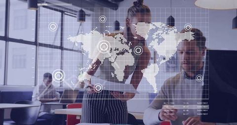 Business professionals analyzing world map data in modern office