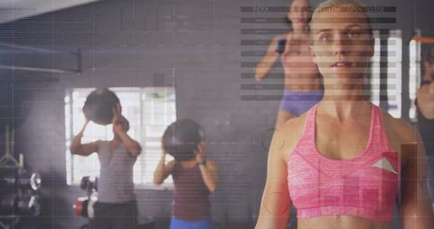 Fitness Trainer Guiding Group Medicine Ball Workout with Abstract Digital Overlay