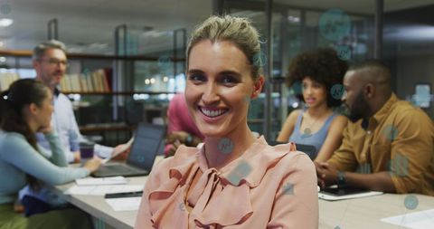 Confident Businesswoman Leads Diverse Team in Modern Office