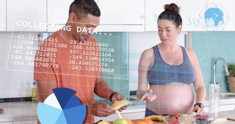 Pregnant woman and partner prepping fresh fruit in modern kitchen with health data overlay