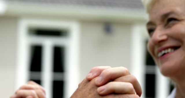 Smiling Elderly Woman Holding Hands Outside House - Download Free Stock Images Pikwizard.com
