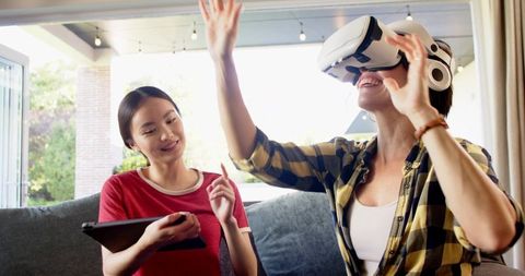 Mother and Daughter Engaging in Virtual Reality Experience