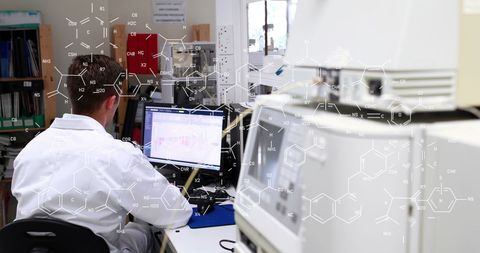 Lab Scientist Analyzing Data with Chemical Formulas Overlay - Download Free Stock Images Pikwizard.com