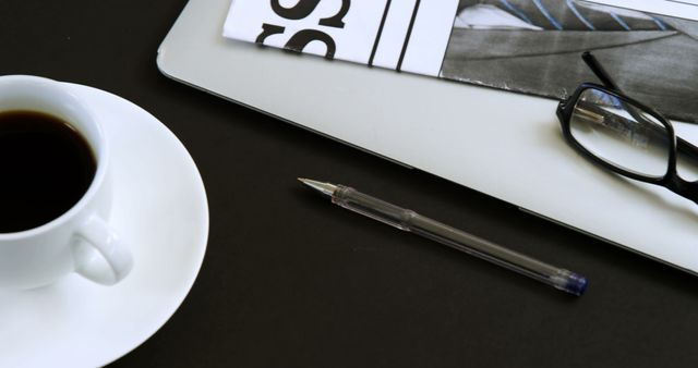 Workspace with Coffee, Pen, Newspaper, and Glasses on Desk - Download Free Stock Images Pikwizard.com