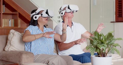 Senior Couple Engaged in Virtual Reality Experience at Home
