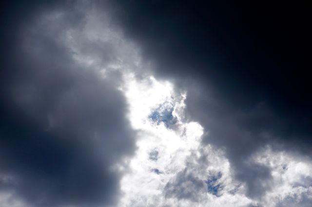 Dramatic Clouds with Bright Sunlight Breaking Through - Download Free Stock Photos Pikwizard.com