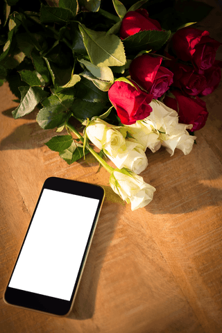 Transparent Mobile Phone Nearby Bouquet of Roses on Rustic Table - Download Free Stock Videos Pikwizard.com