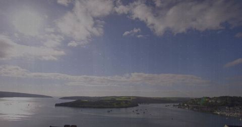 Scenic Coastal Bay with Island and Marina under Clear Sky