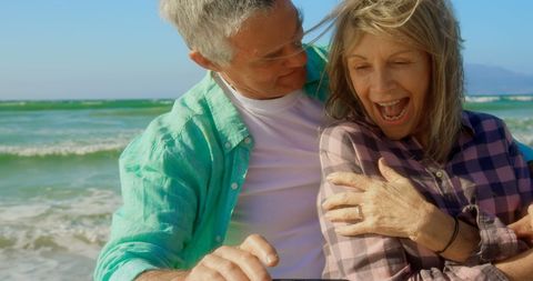 Senior Couple Enjoying Beach Selfie Embrace