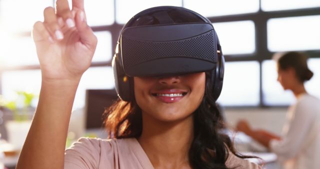 Woman using virtual reality headset at office 4k