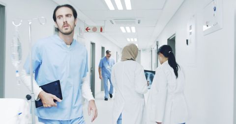Healthcare Professionals in Busy Hospital Corridor with Urgent Atmosphere