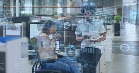 Colleagues Collaborating with AR Data Overlays in Modern Open-Plan Tech Workspace