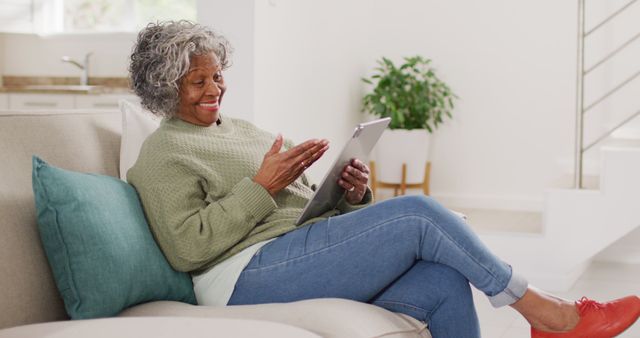 Senior Woman Using Digital Tablet Relaxing at Home - Download Free Stock Images Pikwizard.com