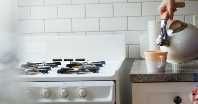 Person Pouring Coffee in Mug on Modern Kitchen Counter - Download Free Stock Images Pikwizard.com