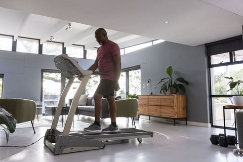 Active Fitness Training on Treadmill in Spacious Home