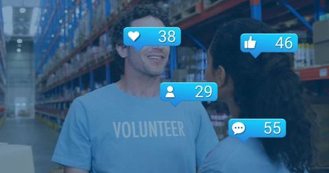 Volunteers talking in warehouse with social media notification overlays and teamwork