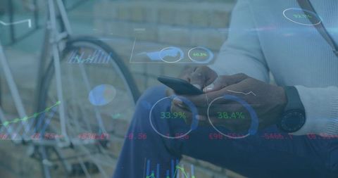 Mature man tapping smartphone with financial analytics hologram overlay near bicycle