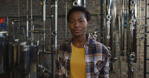 African American Woman Working in Craft Gin Distillery Smiling Joyfully