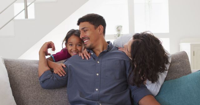 Happy Family Relaxing on Couch in Modern Living Room - Download Free Stock Images Pikwizard.com