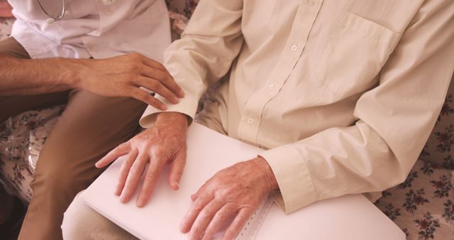 Visually Impaired Senior Reading Braille with Assistance - Download Free Stock Images Pikwizard.com