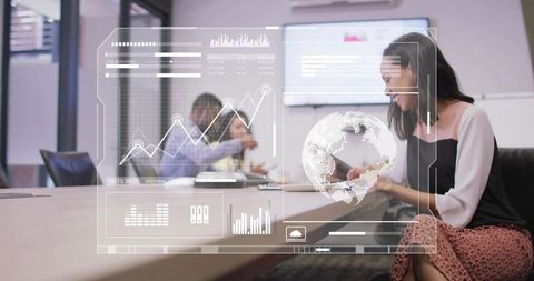 Woman presenting interactive tablet with holographic data visualization in boardroom meeting