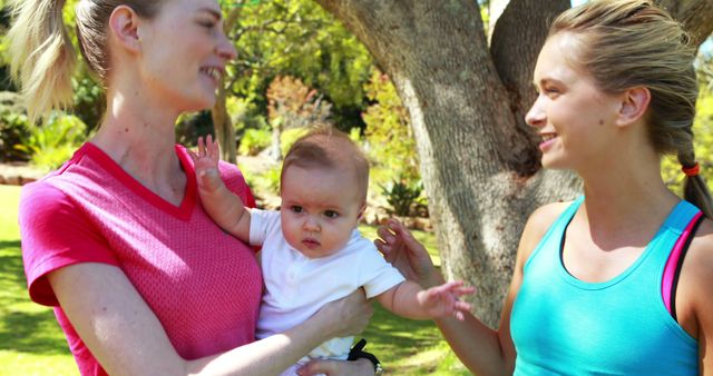 Two Women with Baby Enjoying Day Out in Park - Download Free Stock Images Pikwizard.com