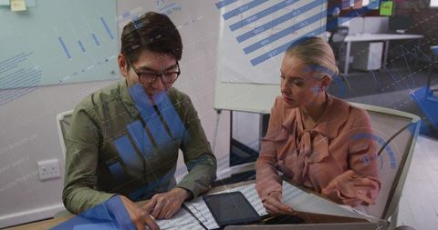 Colleagues Collaborating on Business Strategy Analysis Charts