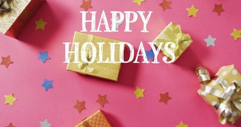 Happy holidays gold gift boxes on pink backdrop with glitter stars, ribbons, festive bow