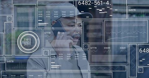 Mature professional holding smartphone analyzing futuristic hud data overlays in office