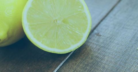 Fresh Juicy Lemon Halved with Rustic Wooden Background