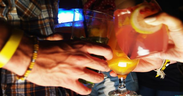 Group of Friends Toasting with Colorful Cocktails at Social Gathering - Download Free Stock Images Pikwizard.com