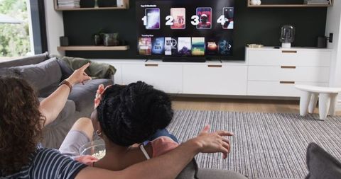 Couple Browsing Movies at Home for Chill Evening Entertainment